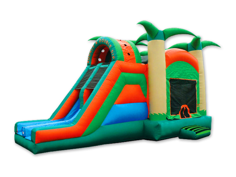 An inflatable tropical bounce house with a dual lane slide attached on a white background.