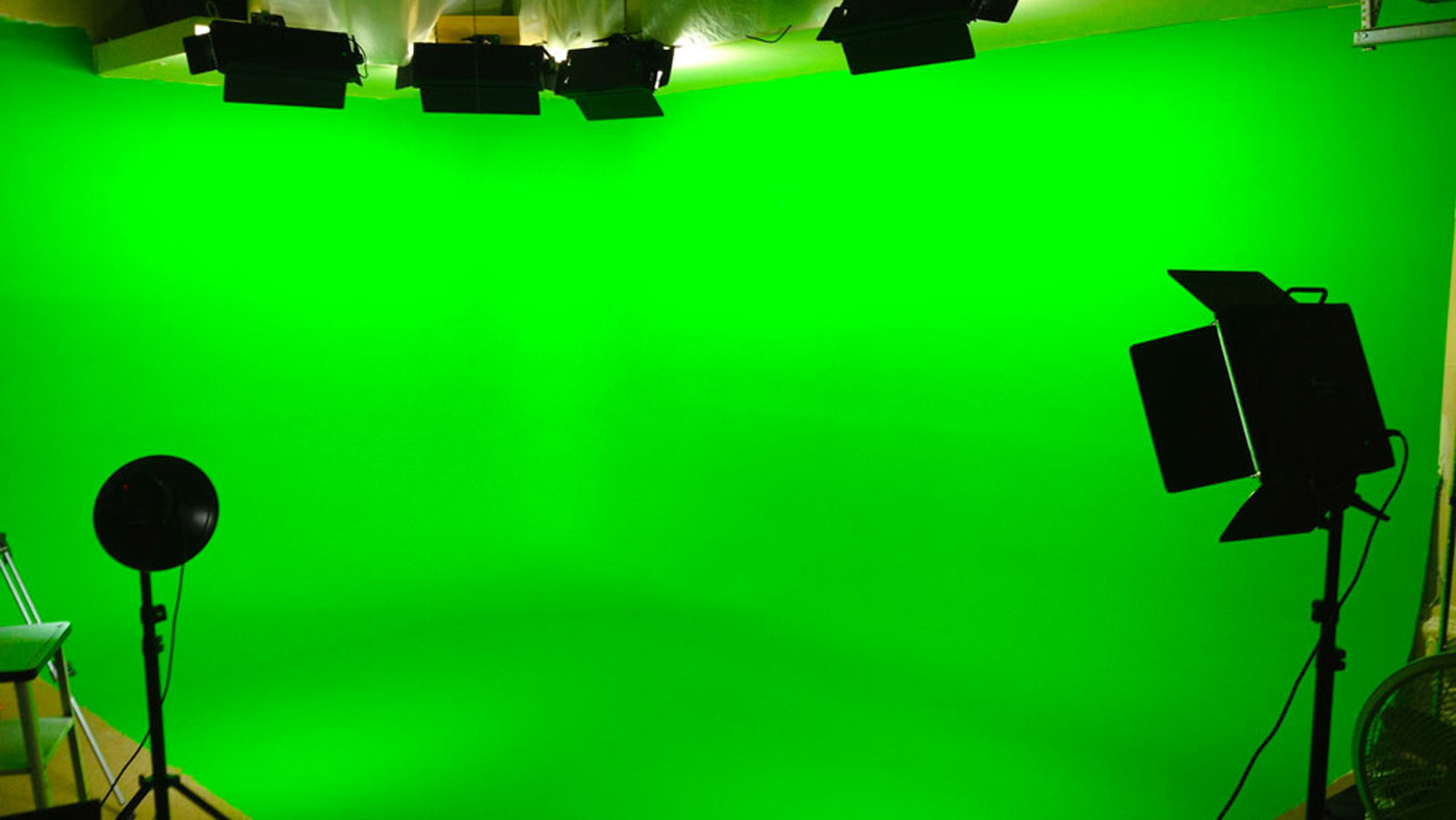 A green screen room with spotlights.