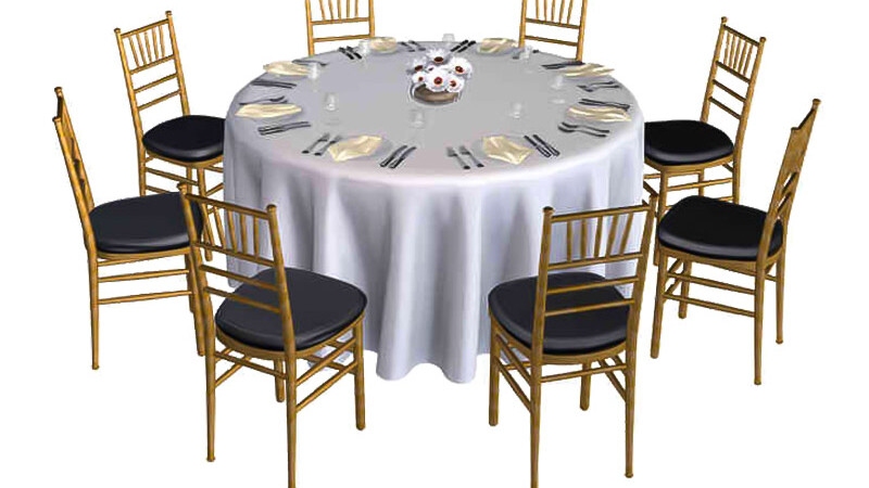 Large round table with eight chairs set with a white table cloth for a nice event.
